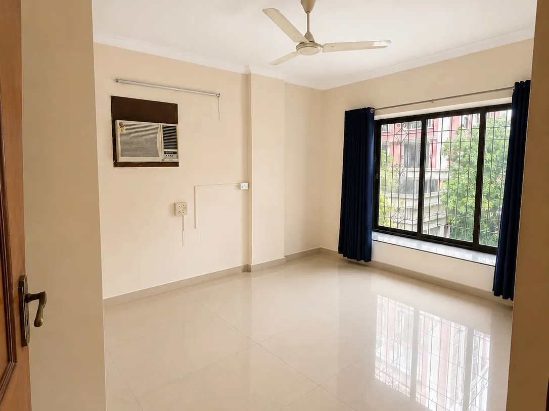 Living room with window seating in a 3 BHK flat near Chembur Gymkhana