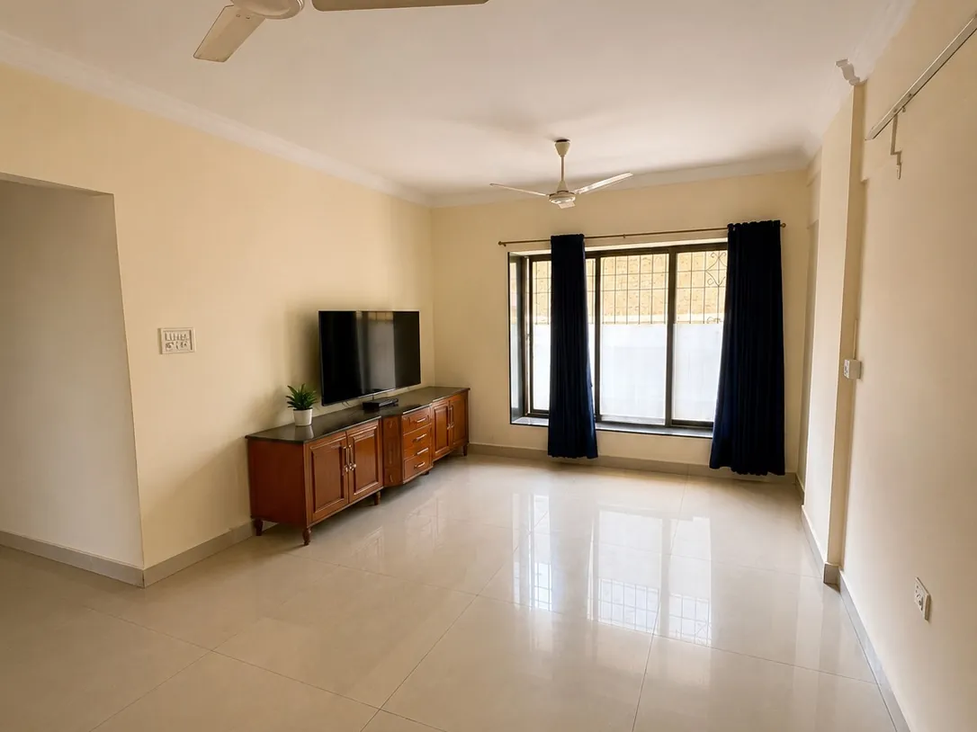 Living room with TV unit in a 3 BHK flat on Central Avenue Road, Chembur