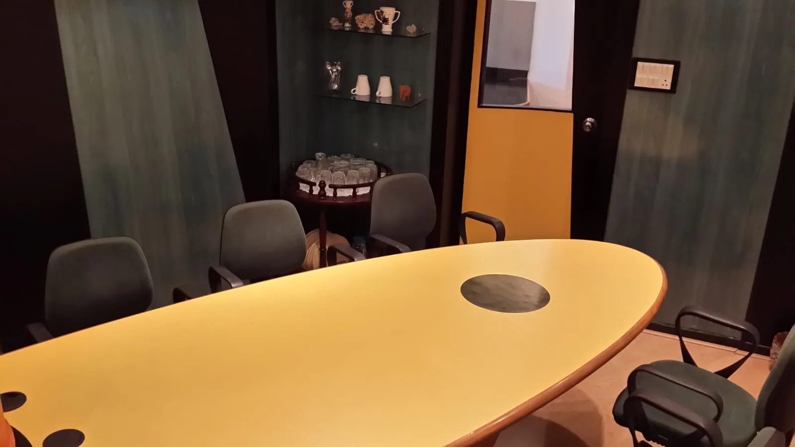 Conference room with oval meeting table in a Chembur office
