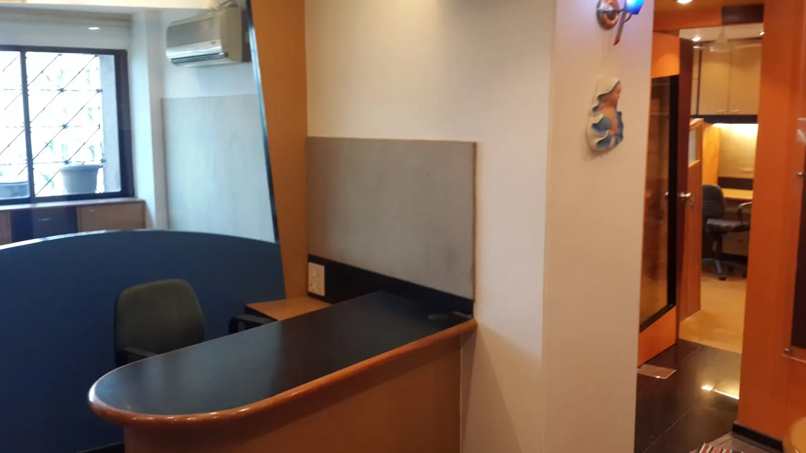 Front desk counter with window in a Chembur office for rent