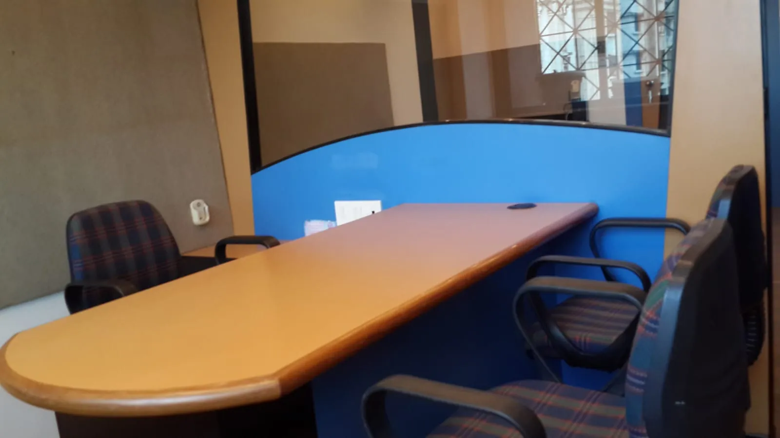 Workstation desk with chairs in a furnished office in Chembur